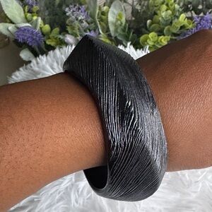 Vintage black Bakelite-style bracelet with a carved, Brutalist-style design